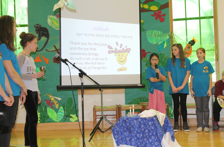 The McGillis School holds a weekly Shabbat celebration every Friday for students, 75 percent of whom are not Jewish. (Uriel Heilman)