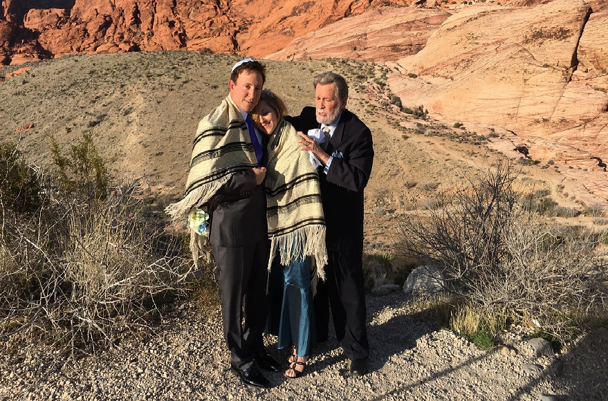 Rabbi Mel Hecht marries Craig Silver and Karen Butt of Connecticut at Red Rock Canyon near Las Vegas, Feb. 12, 2016. (Ron Kampeas)