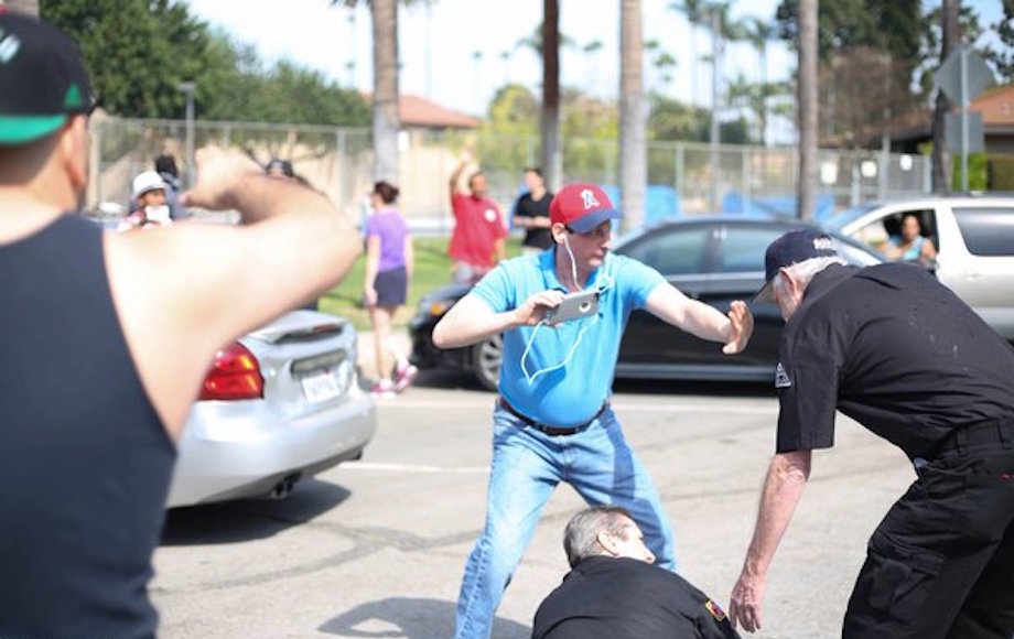 Brian Levin intervening in a confrontation with Ku Klux Klan members in Anaheim, California, March 1, 2016. (Heather Boucher/Davini Photo)