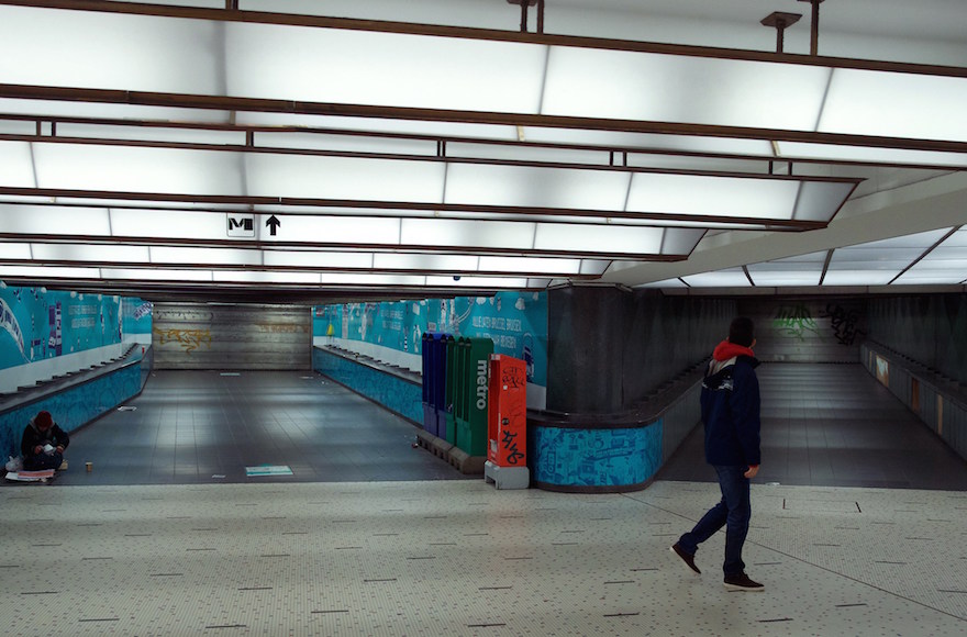 A man walking in an empty tunnel of the closed subway central station in Brussels, Belgium, Nov. 21, 2015. (Nicolas Maeterlinck/AFP/Getty Images)