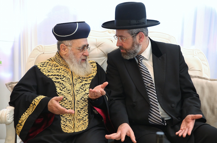 Israel's Sephardic Chief Rabbi Itzhak Yosef, left, and Ashkenazi Chief Rabbi David Lau speaking at an event in Jerusalem, Jan. 11, 2016. (Yaakov Coehn/Flash90)