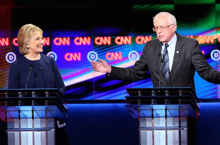 Democratic presidential candidate Senator Bernie Sanders, D-Vt, and Democratic presidential candidate Hillary Clinton speaking during the CNN Democratic Presidential Primary Debate at the Whiting Auditorium at the Cultural Center Campus in Flint, Michigan, March 6, 2016. (Scott Olson/Getty Images)