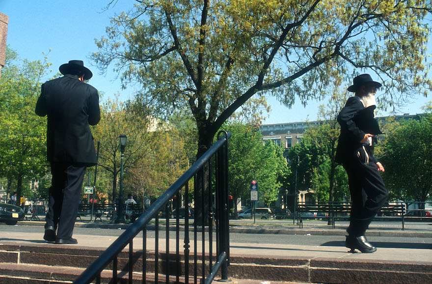 Orthodox Jewish men walking near Chabad international headquarters at 770 Eastern Parkway in Crown Heights, Brooklyn, New York, May 12, 2008. (Serge Attal/Flash90)