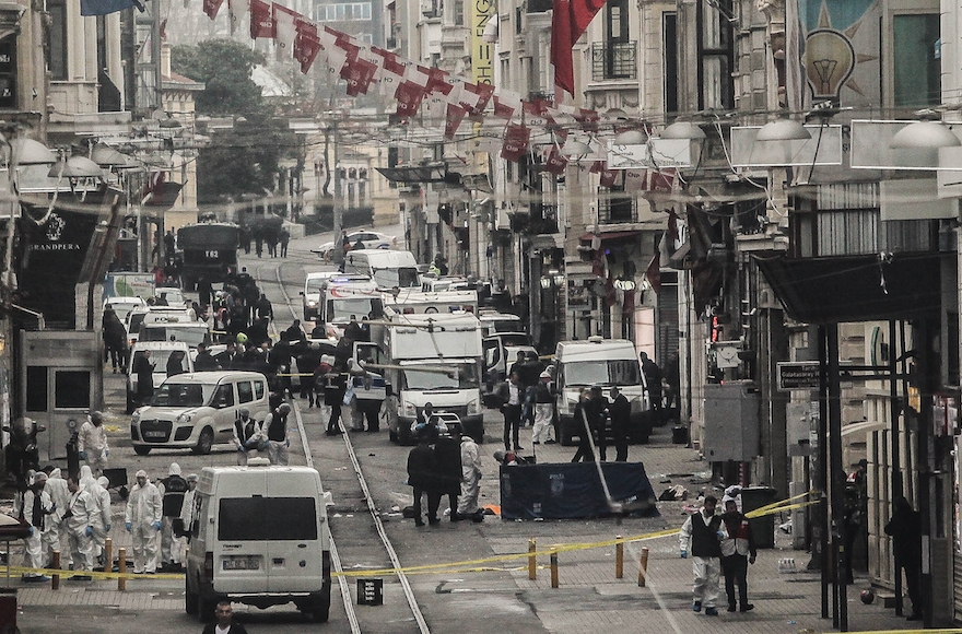 Emergency services inspecting the area following a suicide bombing in a major shopping and tourist district in the central part of Istanbul, Turkey, March 19, 2016 in Istanbul, Turkey. (Burak Kara/Getty Images)