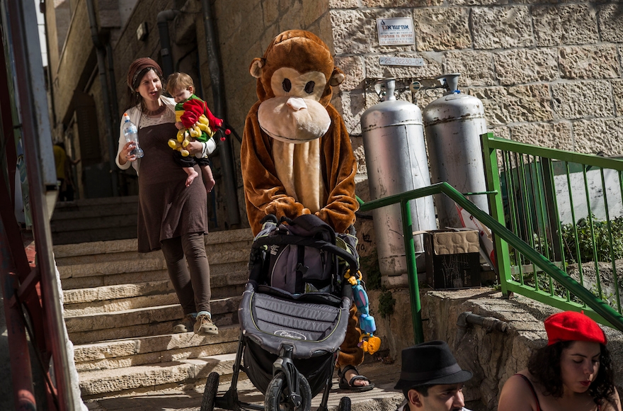 Israeli youth celebrating the festival of Purim at a street party in Jerusalem, Israel, March 6, 2016. (Ilia Yefimovich/Getty Images)