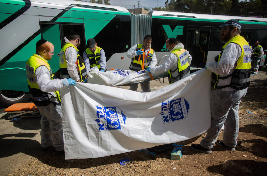 Rescue personnel at the site of a terror attack in the Armon Hanatziv neighborhood of Jerusalem, Oct. 13, 2015. (Yonatan Sindel/Flash90)