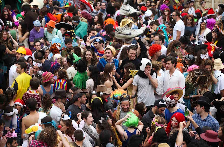 Young Israelis celebrating Purim in the Nahlaot neighborhood of Jerusalem, March 17, 2014. (Nati Shohat/ Flash90)