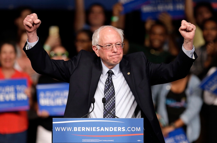 Democratic presidential candidate Bernie Sanders acknowledging supporters at a campaign rally in Miami, March 8, 2016. (AP Photo/Alan Diaz)