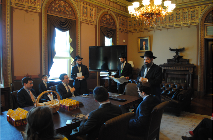 Matt Nosanchuk, seated at end of table attending a Purim Megillah reading at the White House's Diplomatic Reception Room, March 24 2016. (White House)
