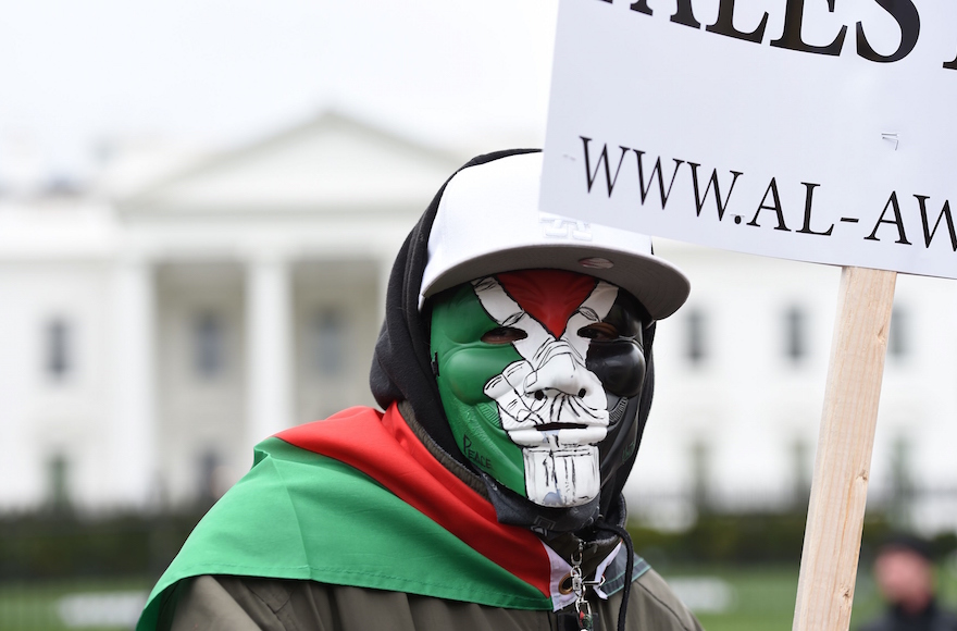A member of the group Anonymous taking part in a National March on Washington to support Palestine in Washington, D.C., March 20, 2016. (Molly Riley/Getty Images)