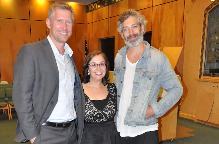 Rabbi Julie Jacobs, center, with NFL Quarterback Sage Rosenfels, left, and musician Matisyahu, celebrating her installation as a rabbi at Beth David Congregation in 2015. Previously the synagogue's cantor, she now works as both. (Courtesy of Beth David Congregation)