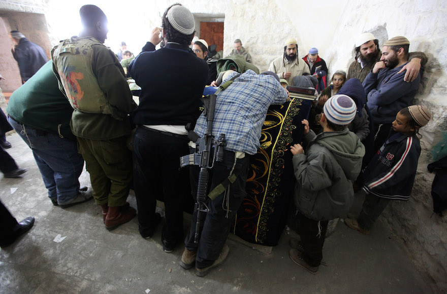 Jewish settlers praying in Joseph's Tomb in the West Bank city of Nablus, Dec. 28, 2010. (Kobi Gideon / Flash90)