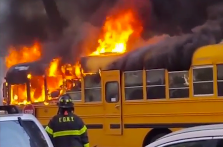 A school bus outside a Jewish school burning in the Crown Heights area of Brooklyn, New York, May 8, 2016. (Screenshot from YouTube)