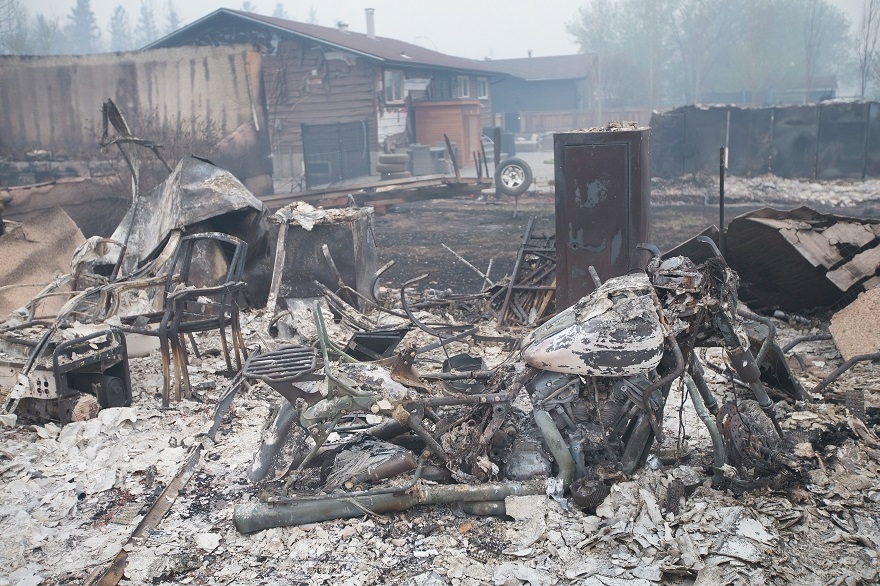 A weeklong wildfire in Fort McMurray, in Canada's Alberta province, has forced the evacuation of tens of thousands of people and caused billions in damages, May 6, 2016. (Scott Olson/Getty Images)