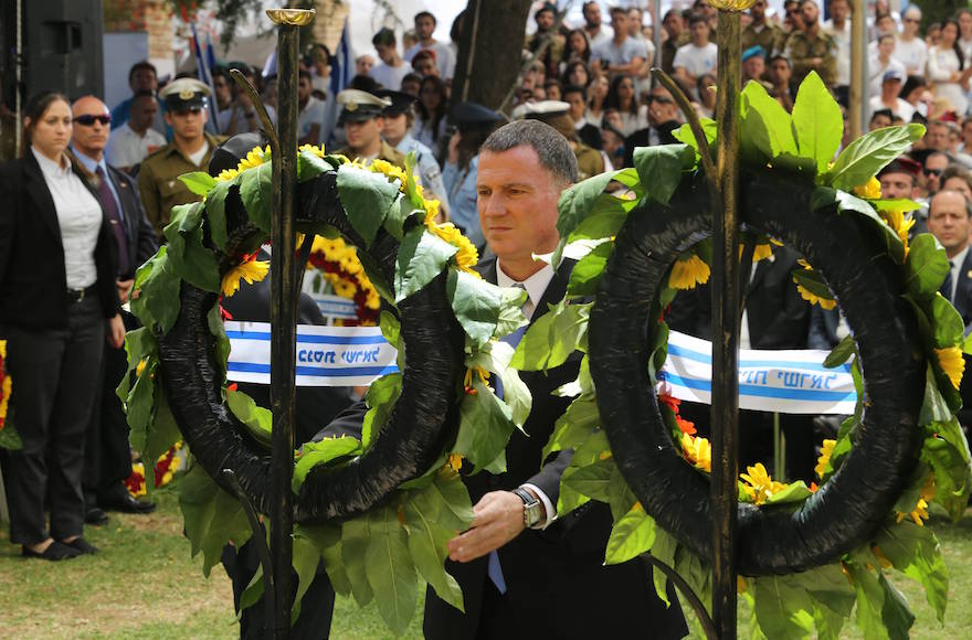 Israeli speaker of parliament Yuli Edelstein laying a wreath during the Memorial Day ceremony in memory of Israel's fallen soldiers and terror victims at Mount Herzl military cemetery in Jerusalem, May 11, 2016. (Gil Yohanan/Pool)