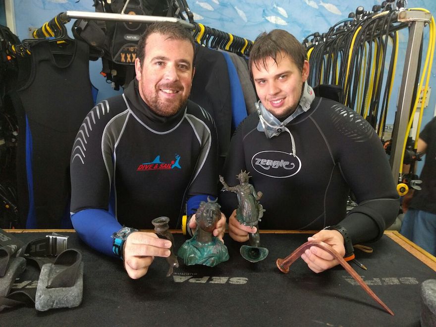 Ran Feinstein (right) and Ofer Ra‘anan after the discovery. (Israel Antiquities Authority/The Old Caesarea Diving Center)
