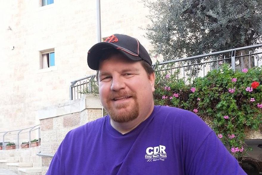 Josh Allen, wearing a shirt from the Jewish day camp where he worked, in Israel in November 2014. (Facebook)