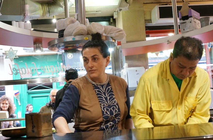 Martine Ouaknine, left, with an employee at Mi-Va-Mi in Paris's historical Jewish quarter on May 18, 2016. (Cnaan Liphshiz)