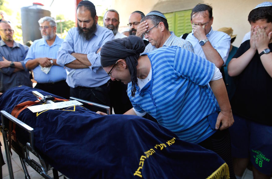 Rina, the mother of Israeli Hallel Ariel, a 13-year-old girl who was fatally stabbed by a Palestinian attacker in her home, mourns during her funeral in the Kiryat Arba settlement outside the West Bank city of Hebron, June 30, 2016. (Gil Cohen-Magen/AFP/Getty Images)