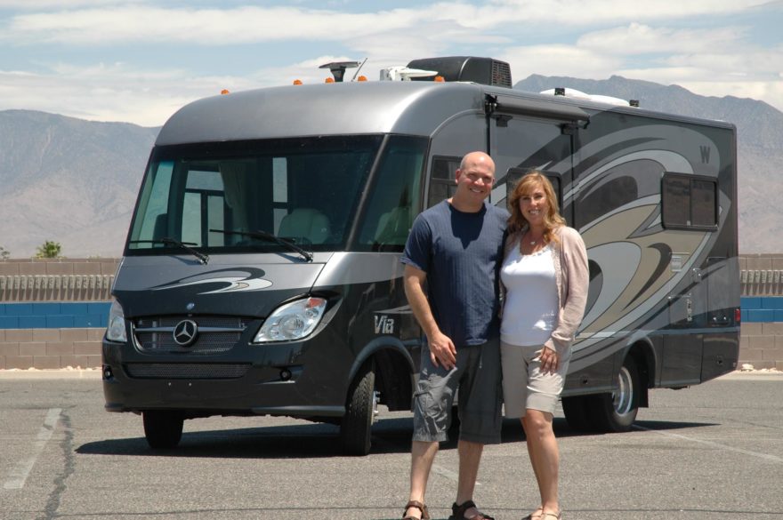 Brad and Amy Herzog pose in front of an RV in 2012 (Courtesy Brad Herzog)