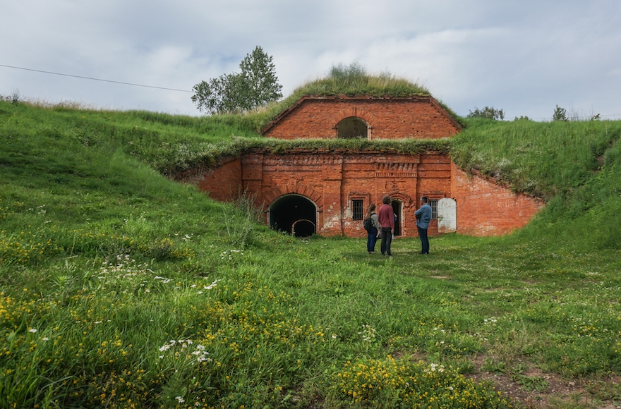 A film crew preparing to record at the former concentration camp known as the Seventh Fort in Kaunas, Lithuania, on July 12, 2016. (JTA/Cnaan Liphshiz)