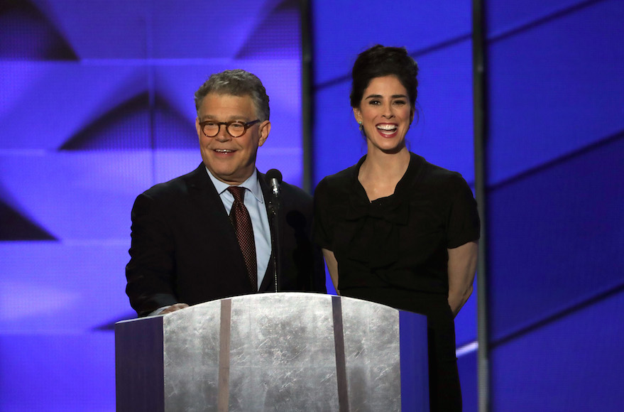 PHILADELPHIA, PA - JULY 25: Sen. Al Franken (D-MN) speaks as Comedian/actress Sarah Silverman speaks looks on during the first day of the Democratic National Convention at the Wells Fargo Center, July 25, 2016 in Philadelphia, Pennsylvania. An estimated 50,000 people are expected in Philadelphia, including hundreds of protesters and members of the media. The four-day Democratic National Convention kicked off July 25. (Photo by Alex Wong/Getty Images)