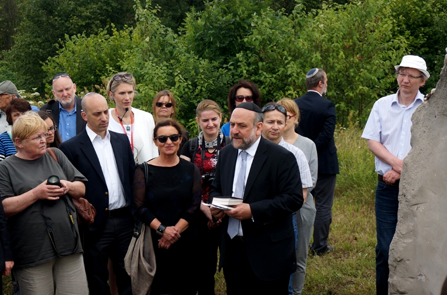 Michael Schudrich, Poland's chief rabbi, reciting a prayer for the victims of the Jedwabne massacre at the town's Jewish cemetery on July 10, 2016. (JTA/Cnaan Liphshiz)