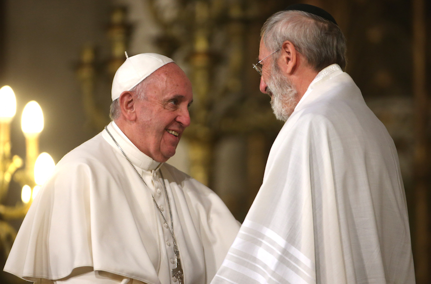 Pope Francis, left, greeting the chief rabbi of Rome, Riccardo Di Segni, during a papal visit to the city’s synagogue, Jan. 17, 2016. (Franco Origlia/Getty Images)