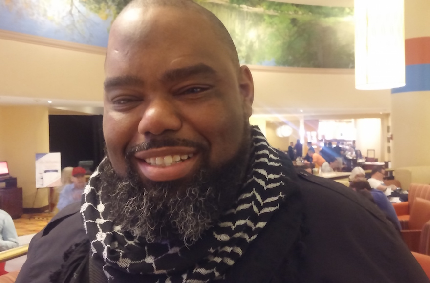 Florida State Senator Dwight Bullard, wearing a Palestinian keffiyeh, or headscarf, said Palestinians should have the right to citizenship in Israel. He visited the West Bank and Israel in May as part of a delegation from the Black Lives Matter movement. (Ben Sales)