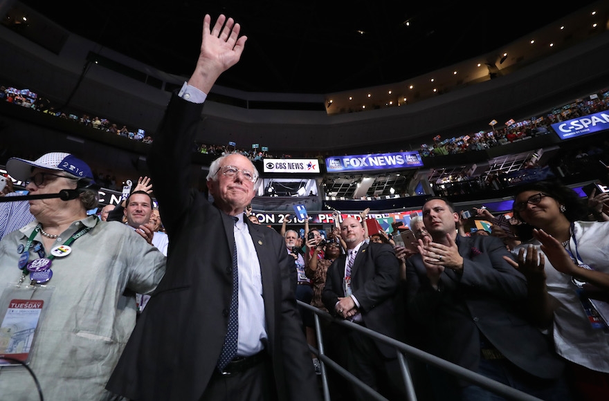 Bernie Sanders waving to the crowd after the Vermont delegation cast their votes during roll call on the second day of the Democratic National Convention at the Wells Fargo Center in Philadelphia, July 26, 2016. (Chip Somodevilla/Getty Images)