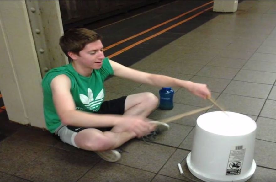 Gideon Grossman says he gets a rush from busking in front of strangers. (Screenshot from YouTube)