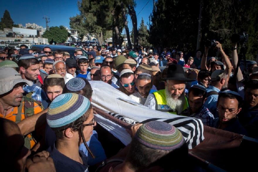 Friends and family carrying the body of Rabbi Michael 