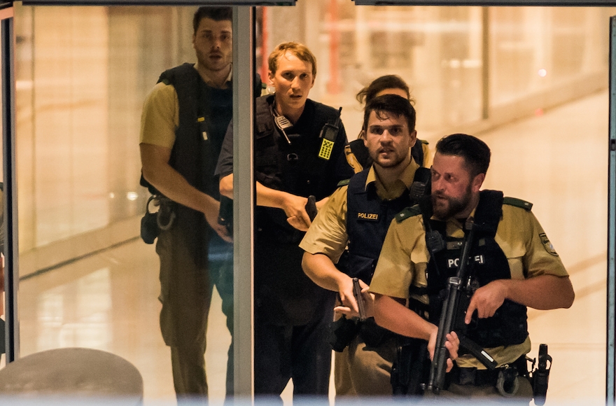 Police officers responding to a shooting at the Olympia Einkaufzentrum (OEZ) in Munich, Germany, July 22, 2016. (Joerg Koch/Getty Images)