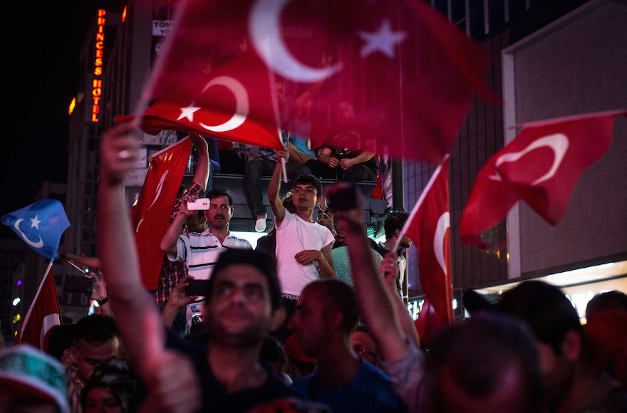 People waving Turkish flags at a rally on the streets of Kizilay Square in Ankara, Turkey, in reaction to the failed military coup, July 17, 2016. (Chris McGrath/Getty Images)
