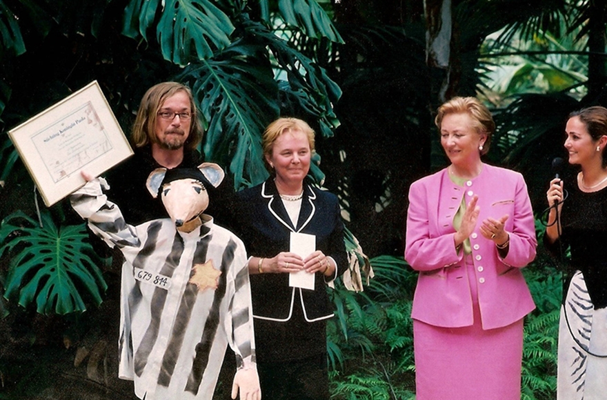 Luc Descheemaeker, left, receiving an award from Belgium's Queen Paola in 2002. (Courtesy of Sint-Jozefs Institute)