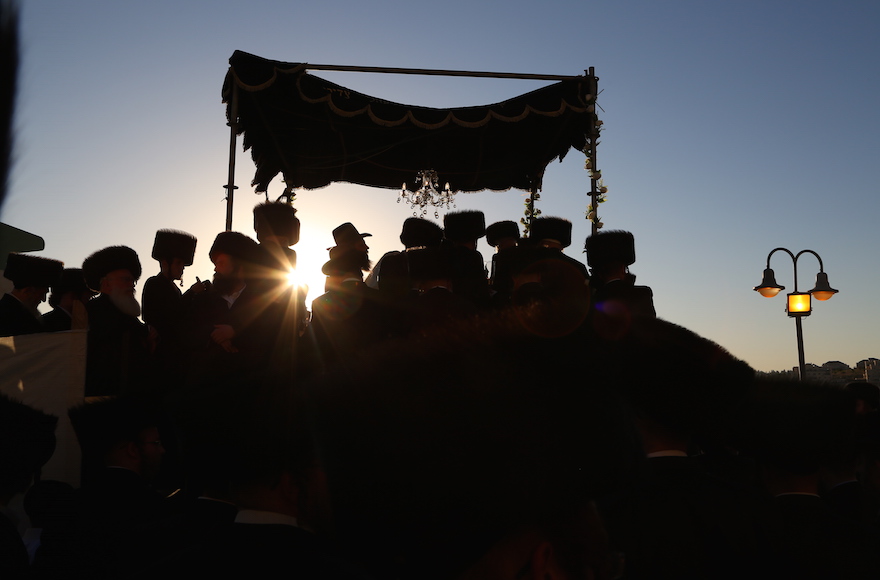 Hasidic Jewish men celebrating a wedding in an illustrative image. (Yaakov Lederman/Flash90)