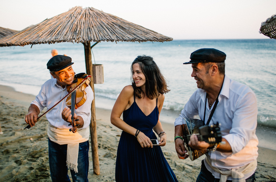 Wedaway founder and CEO Gal Zahavia sharing a moment with Greek musicians in Evia, Greece, DATE.