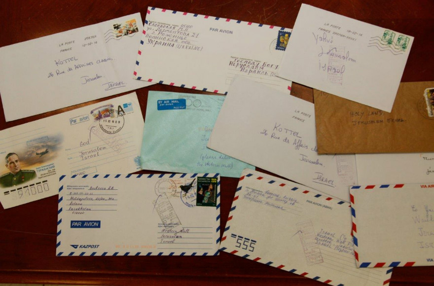 Letters from around the world addressed to God, Our Heavenly Father and the Kotel are delivered to the Western Wall before the High Holidays and placed between the stones of the holy site. (Photo/ Ran Dickstein)