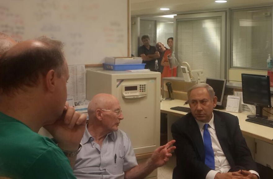 Israeli Prime Minister Benjamnin Netanyahu being briefed by staff at Chaim Sheba Medical Center at Tel Hashomer outside of Tel Aviv, Sept. 14, 2016 during his visit to the bedside of former Israel President Shimon Peres, who suffered a stroke on Sept. 13. (Office of the Prime Minister) 