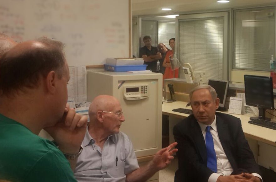 Israeli Prime Minister Benjamnin Netanyahu being briefed by staff at Chaim Sheba Medical Center at Tel Hashomer outside of Tel Aviv, Sept. 14, 2016 during his visit to the bedside of former Israel President Shimon Peres, who suffered a stroke on Sept. 13. (Office of the Prime Minister)