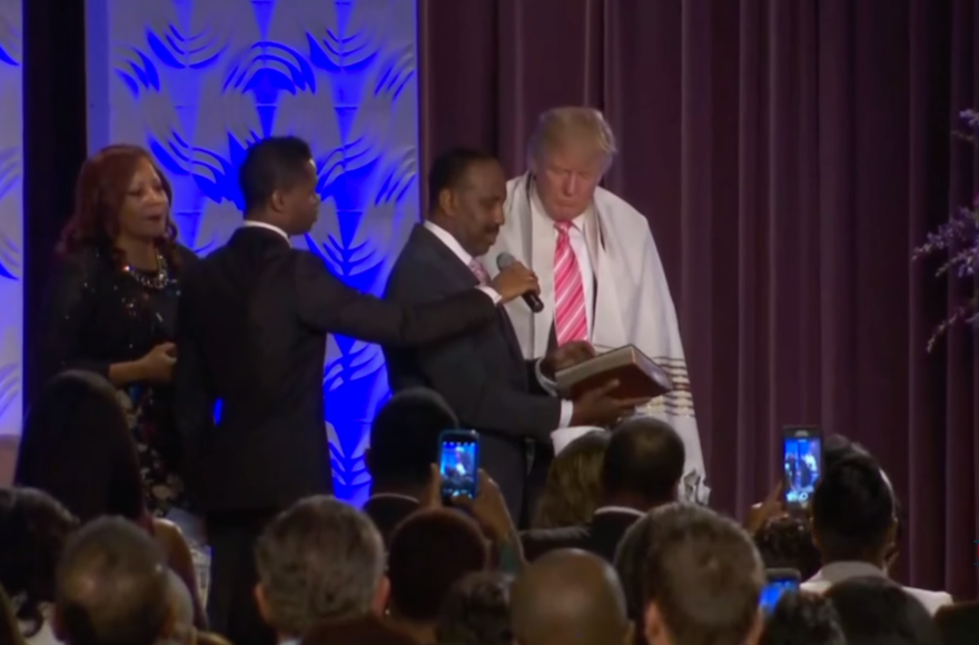 Donald Trump receiving a tallit from Bishop Wayne Jackson of the Great Faith Ministries in Detroit, Sept. 3, 2016 (Screenshot from YouTube)