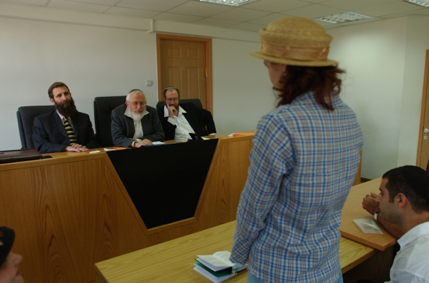 A women converts to Judaism in front of a three-judge Orthodox rabbinic court in Jerusalem. (Flash90)