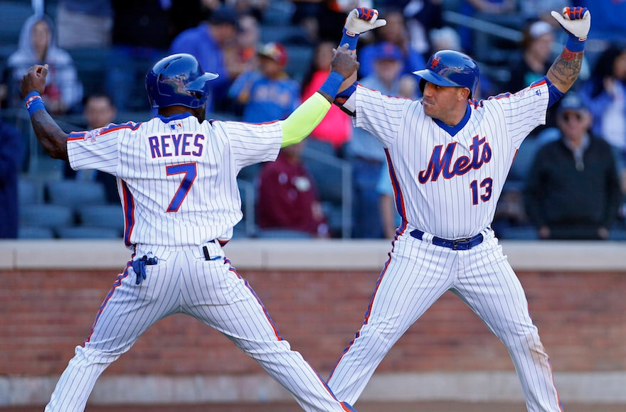 Jose Reyes, left, celebrating with teammate Asdrubal Cabrera during a game against the Philadelphia Phillies at Citi Field in New York, Sept. 25, 2016. (Adam Hunger/Getty Images)