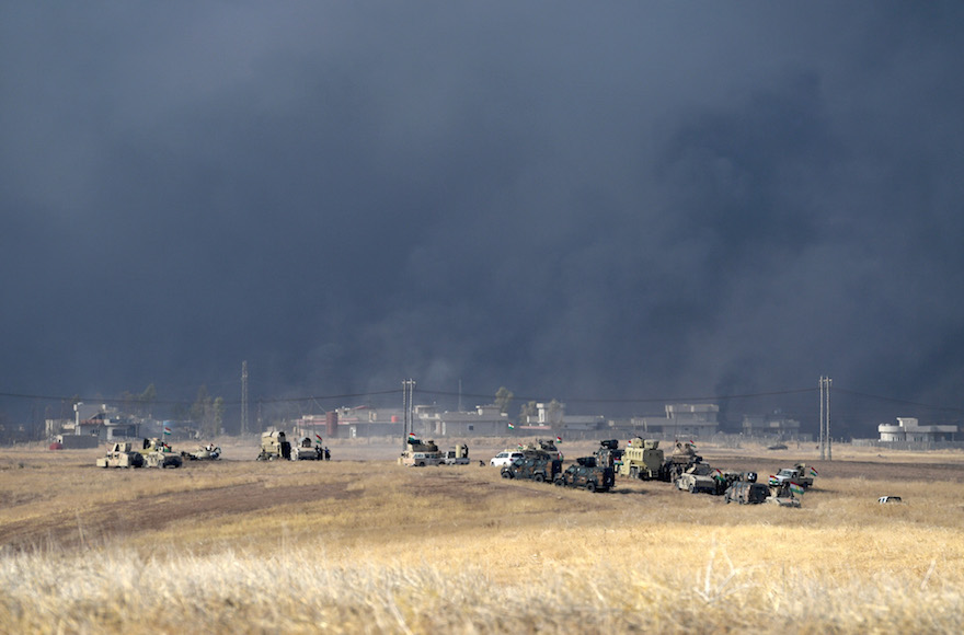 Smoke billowing from a combined aircraft, artillery and ground attack as Kurdish forces battle to recapture the Iraqi village of Tiskharab, near Mosul, from ISIS, Oct. 20, 2016. (Carl Court/Getty Images)