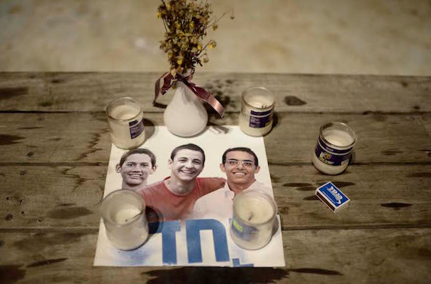 Israelis lit candles in Tel Aviv's Rabin Square to mourn the death of three teenagers who were abducted and murdered in the West Bank, July 6, 2014. (Tomer Neuberg/Flash90)