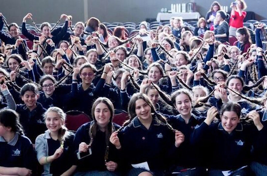 Students at Beth Rivkah Ladies College in Melbourne, Australia before donating their hair to make wigs for Israeli children with cancer, Sept. 2016 (Courtesy of Chana Franck/Chabad.org)