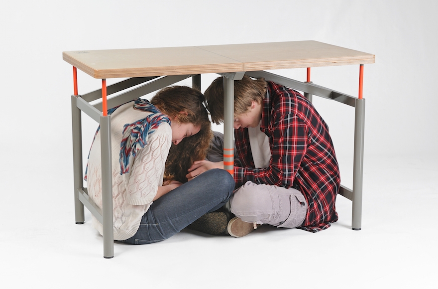 Arthur Brutter designed a table that provides shelter during earthquakes as his final project at Israel's Bezalel Academy of Arts and Design (Tzur Kotzer)