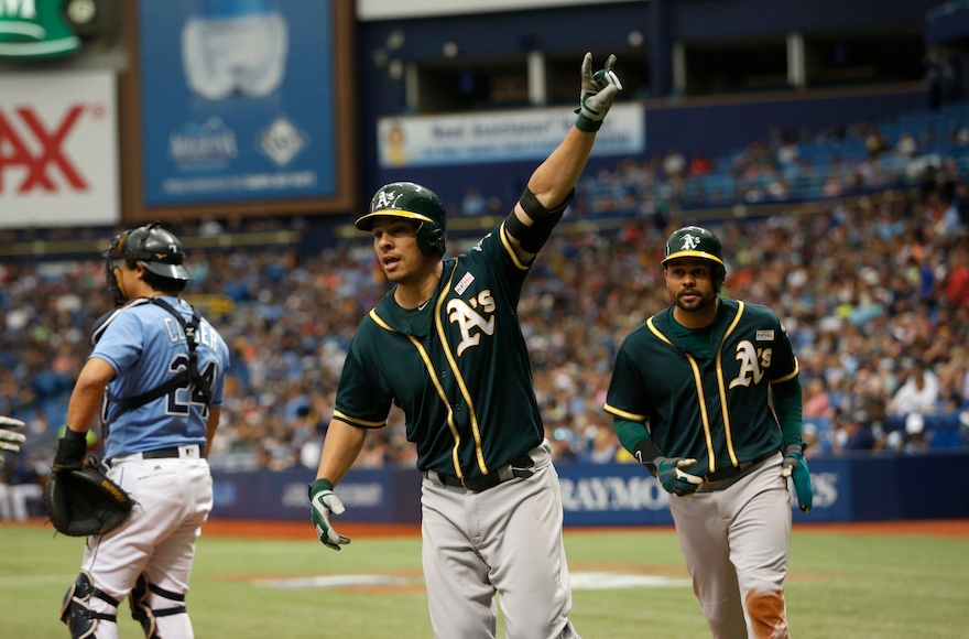 Danny Valencia, center, after hitting a home run at Tropicana Field in St. Petersburg, Florida, May 15, 2016. (Brian Blanco/Getty Images)