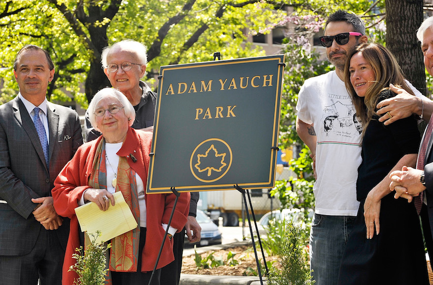 Noel and Frances Yauch, second from left, and former Beastie Boys member Adam Horovitz and wife Rachael, with New York City and Brooklyn officials standing by the plaque marking Adam Yauch Park in Brooklyn, May 3, 2013. (Daniel Zuchnik/Getty)