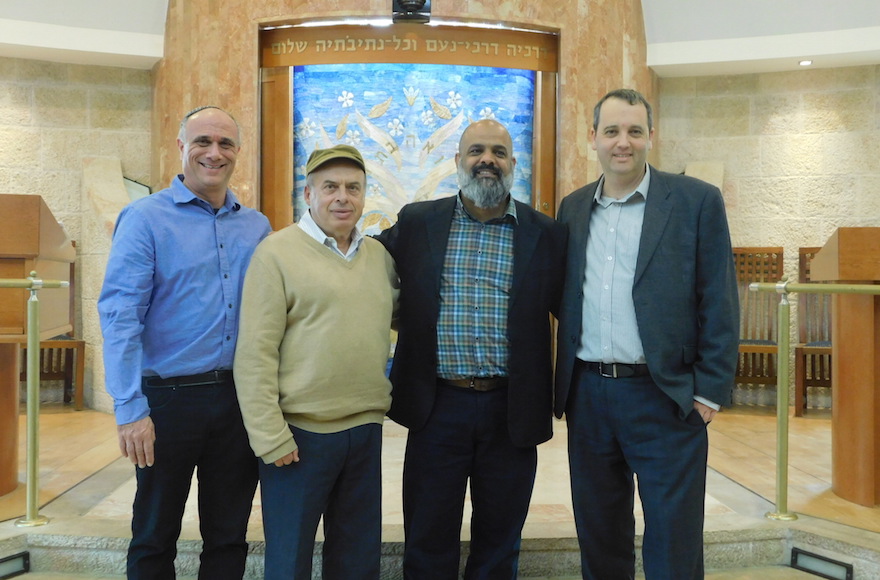 Jewish Agency Chairman Natan Sharansky, second from left, with Rabbi Daniel Meyer, far left, Yossi Cohen, center right, and Israel Movement for Reform and Progressive Judaism Executive Director Rabbi Gilad Kariv, far right, at Kehillat Ra’anan – Beit Samueli in Raanana, Israel, November 30, 2016. Hate graffiti and death threats were discovered on Nov. 24, 2016. (Adi Romem, Beit Samueli – Kehillat Ra’anan via Jewish Agency for Israel)